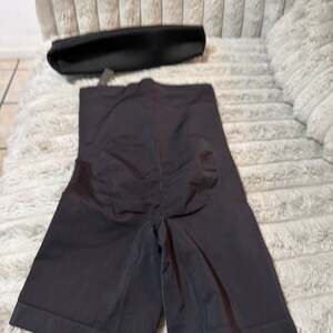 SKIMS black shorts size small with butt lift